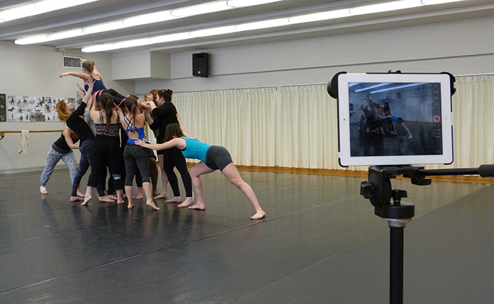 A group of students dancing while being filmed
