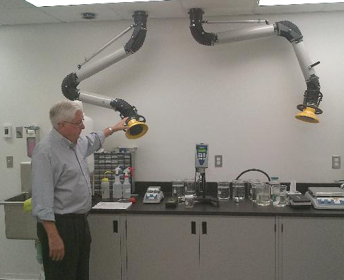 A lab table with spot dust extractors