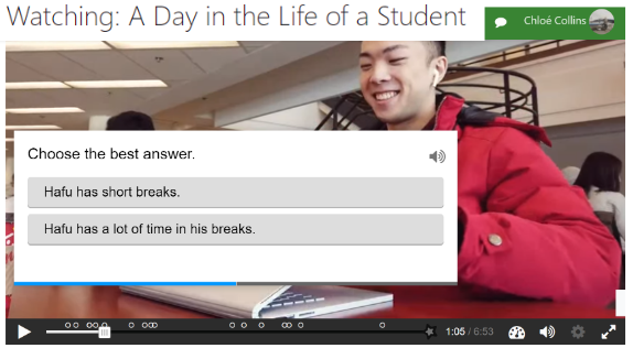 Computer screenshot of an activity entitled “Watching: A Day in the Life of a Student.” We see a screen of a video that has been paused. A wide-smiling student wearing a red coat is closing his laptop. A pop-up window displays a prompt: “choose the best answer” and underneath are two answer options.