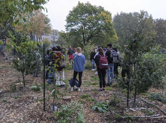 A group of John Abbott College students getting a tour of the food forest.